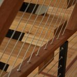 Wood angle tension into top of handrail close up Wood angle tension into top of handrail close up