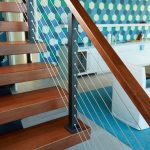 Close up of Cable Rail with Wood Handrail and Thick Treads Close up of Cable Rail with Wood Handrail and Thick Treads